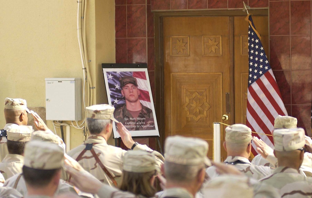 Soldiers salute during the opening ceremony for the Sgt. Matt Maupin Comput