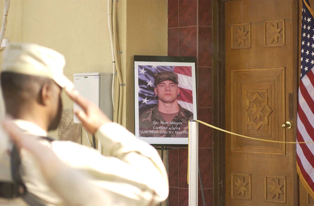 A Soldier salutes during the opening ceremony for the Sgt. Matt Maupin Comp