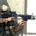 A Dutch soldier looks through his rifle scope