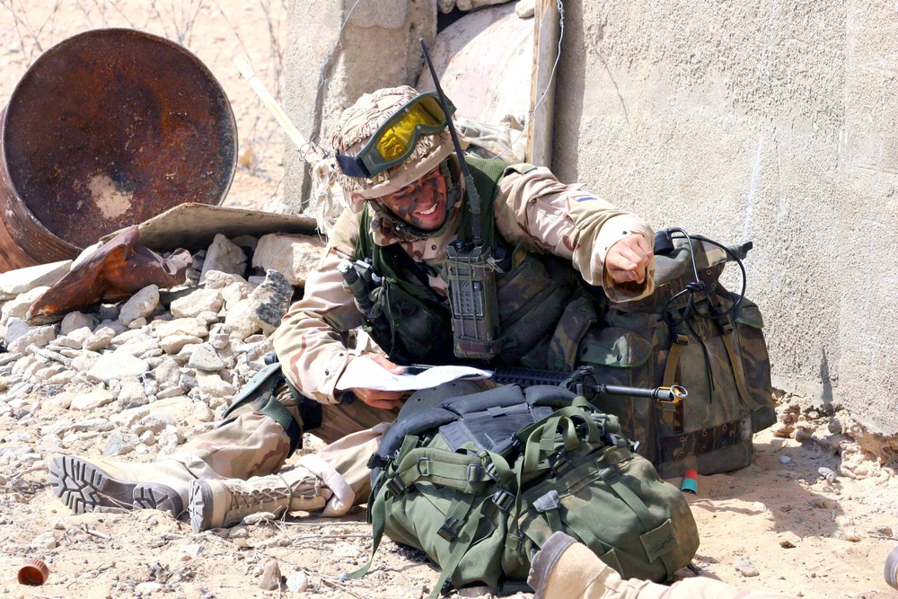 A Dutch squad leader directs his Soldiers