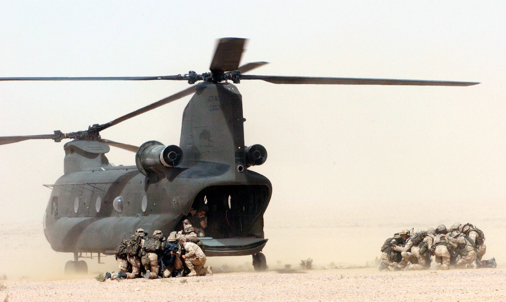 Members of the Dutch NL Air Assault Task Force dismount a CH-47