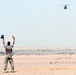 A member of The Dutch Royal Army guides in a CH-47 helicopter