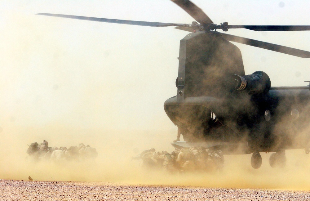 Dutch Army Soldiers exit a CH-47 helicopter