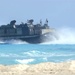 A U.S. Navy LCAC Vessel rushes onto shore