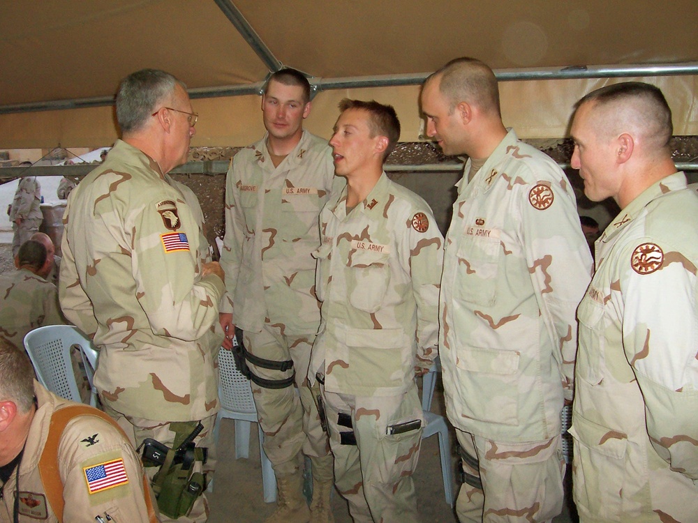 Maj. Gen. Raymond Rees talks with junior officers