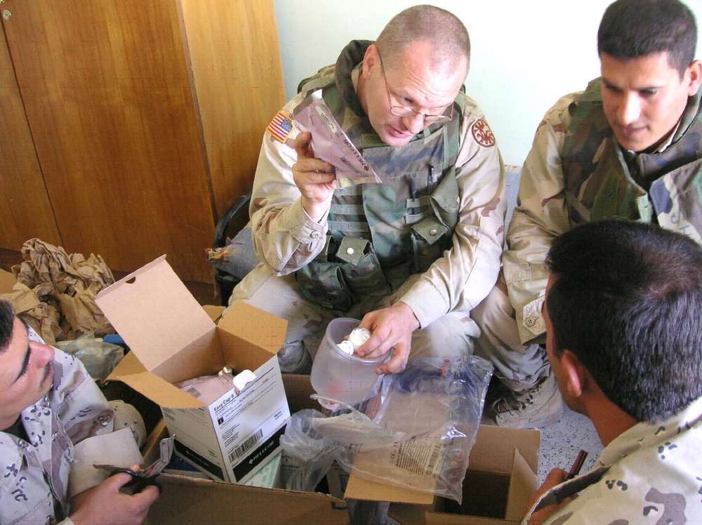 Staff Sgt. Dean Sowers explains the use of medical supplies