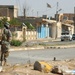Paratroopers block off a street in Tall Afar