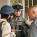 Lt. Hollenbeck gives a resident of Tall Afar, Iraq, a phone number