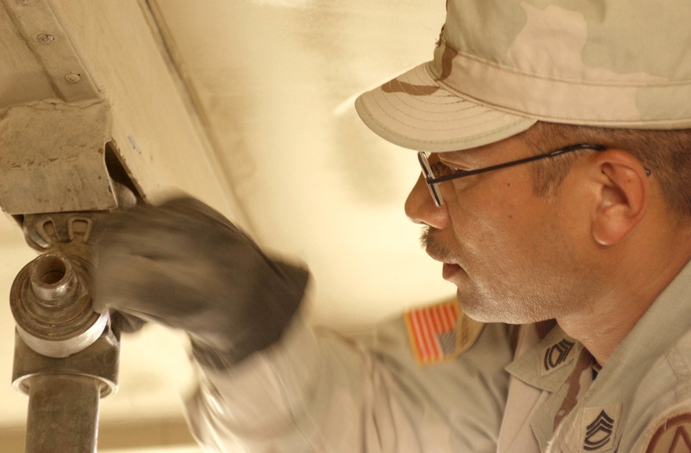 Sgt. 1st Class Enriquez Tightens the Supporting Elements on a EECP Expando