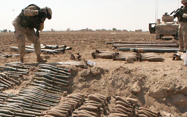 Soldiers continue to uncover munitions in a large weapons cache