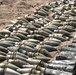 Soldiers continue to uncover munitions in a large weapons cache