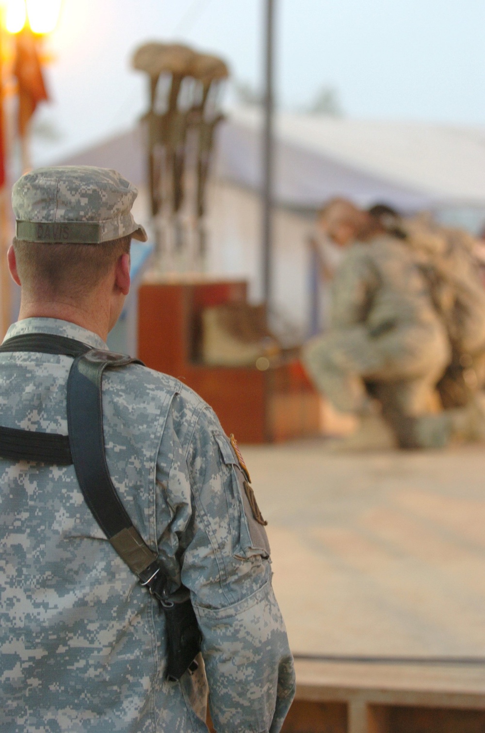 Lt. Col. John Davis watches as Soldiers say goodbye to fallen comrades