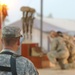 Lt. Col. John Davis watches as Soldiers say goodbye to fallen comrades