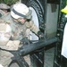 Spc. Gonzales smashes a gate open during a raid