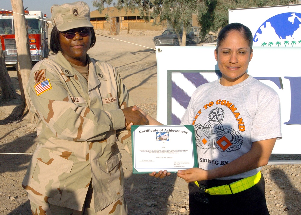 Sgt. 1st Class Delia McKalpain presented a certificate of achievement