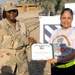 Sgt. 1st Class Delia McKalpain presented a certificate of achievement