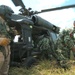 A U.S. Army Aircrew Member Oversees the Unloading of a UH60 Blackhawk