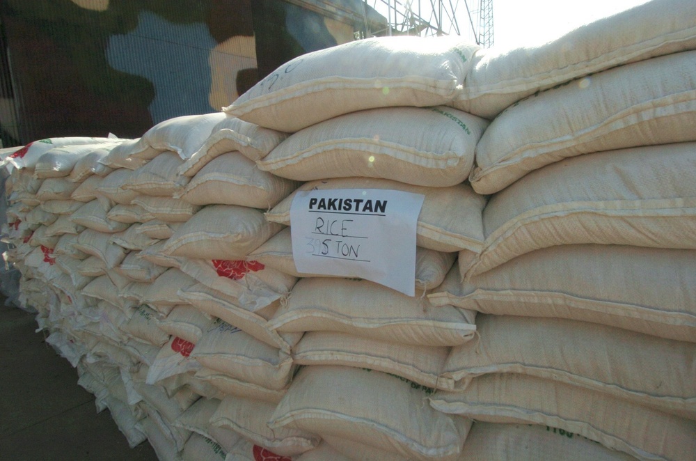 Large Sacks of Rice Are Stacked in a Hangar in Chaklala