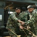 Members of the Pakistan Military Unload a U.S. Army UH-60 Blackhawk