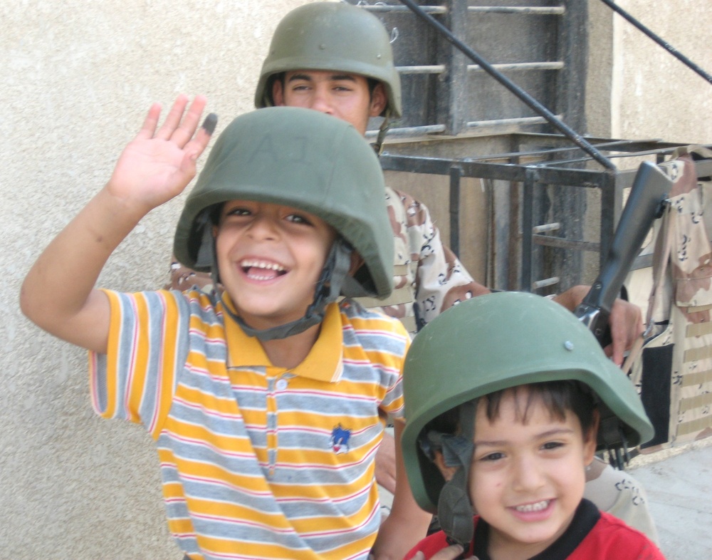 Iraqis of all ages vote, kids celebrate holiday