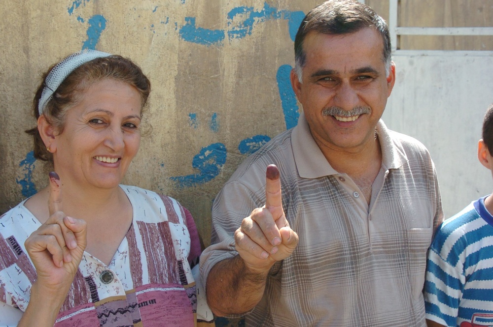 Iraqis of all ages vote, kids celebrate holiday