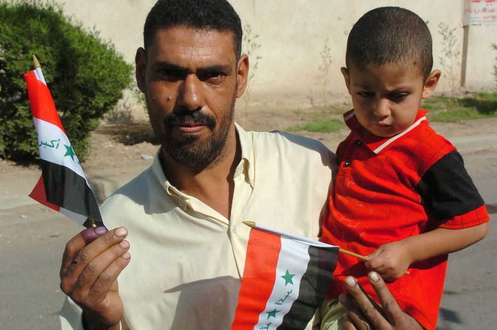 Iraqis of all ages vote, kids celebrate holiday