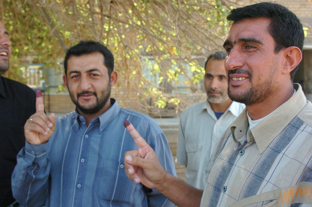 Iraqis of all ages vote, kids celebrate holiday