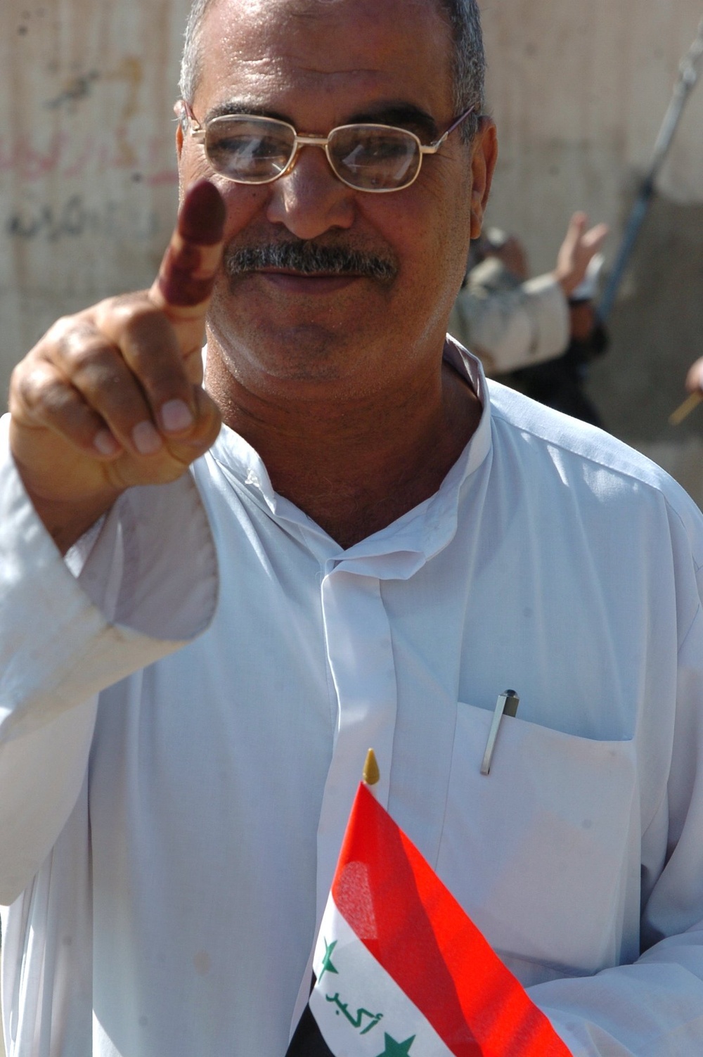 Iraqis of all ages vote, kids celebrate holiday