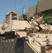 Soldiers stand guard in their M2 Bradley Fighting Vehicle