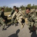 U.S. Army and Pakistani Soldiers rush to unload U.S. medical supplies