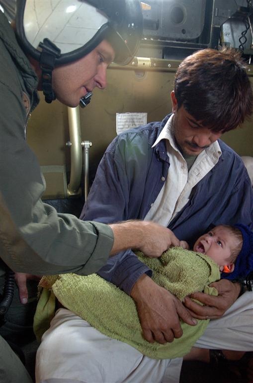 Petty Officer Wilkins comforts a Pakistani baby