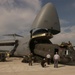 A CH-47 helicopter is loaded onto a C-5 Galaxy