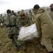 Pakistani soldiers unload disaster relief supplies