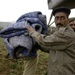 Pakistani soldiers unload disaster relief supplies