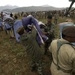 Pakistani soldiers unload disaster relief supplies