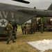 U.S. Navy Sailors and members of the Pakistan military load a MH-53E Sea Dr