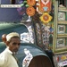 A Pakistani relief worker waits while his truck is unloaded