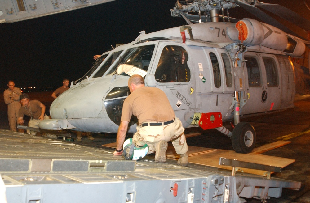 Darryll Connor Loads an MH-60 Helicopter Onto a U.S. Air Force C-17