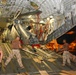 Devon Kimble and Roderick Woods Help Load a Helicopter Onto a C-17