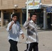 Two Iraqi men leave a polling site