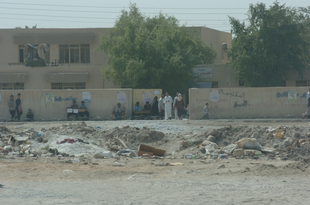 Iraqis leave a polling station