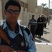 An Iraqi Police officer guards a polling site