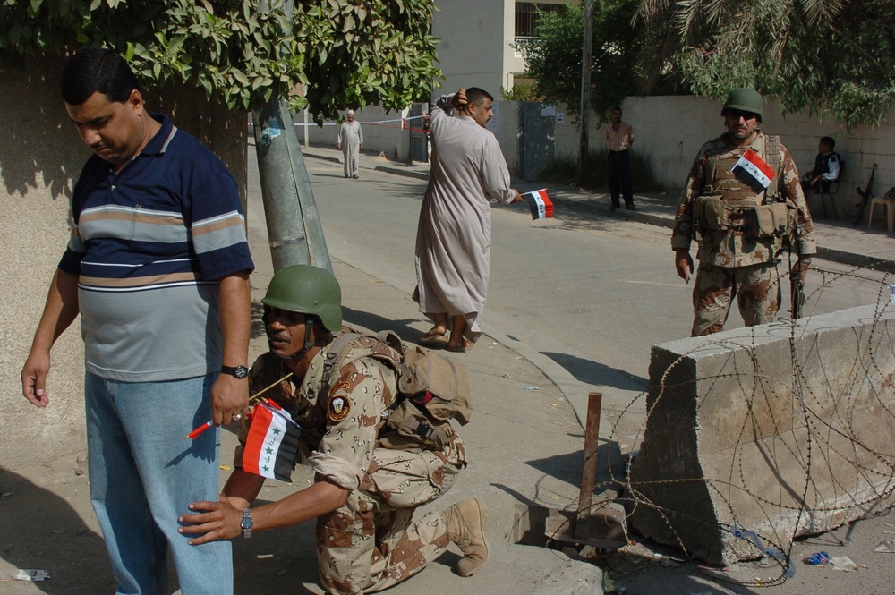 Iraqi Soldiers keep a polling site secure