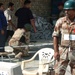 An Iraqi Soldier keeps a watchful eye out for suspicious activity