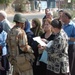 An Iraqi Soldier talks with local residents