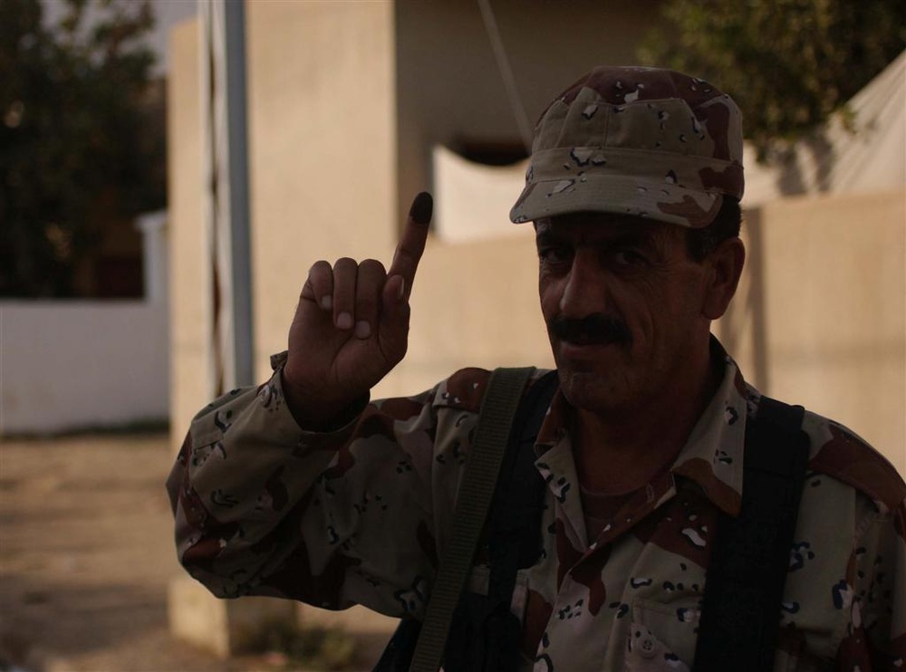 ISF Soldier shows his purple finger