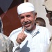 An Iraqi man holds up his finger to show paratroopers that he voted