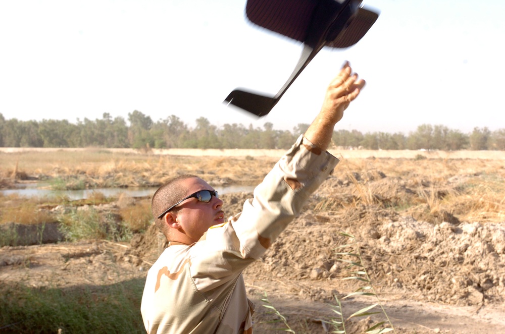 Sgt. Skinner launches the TACMAV by hand