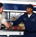 MCPON Scott greets  Quartermaster 3rd Class Washington