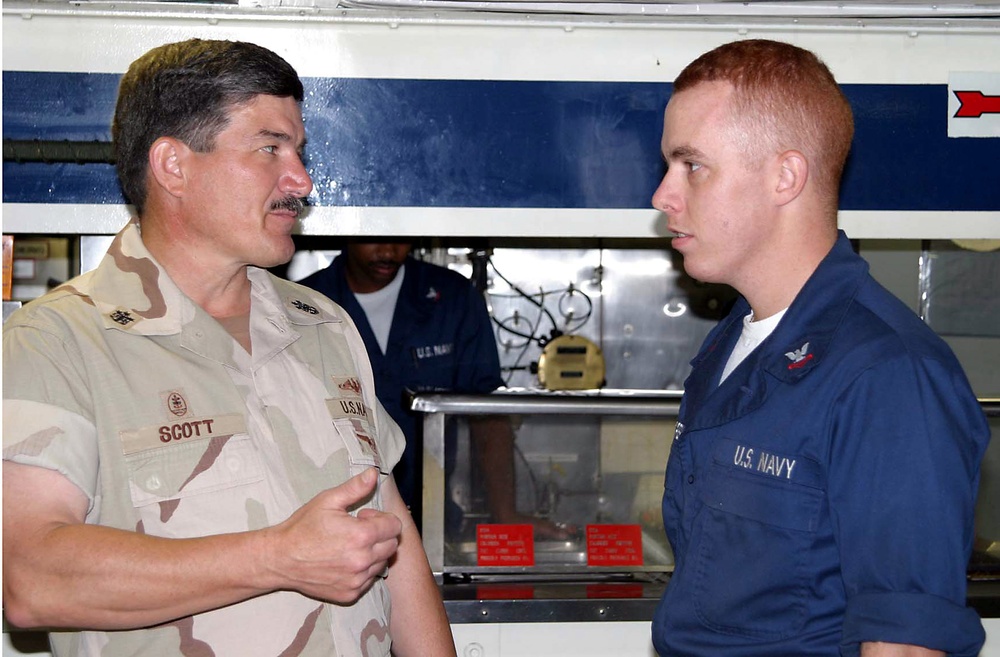 MCPON Scott greets Quartermaster 2nd Class McCreary